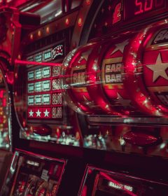 Close-up of colorful slot machine reels and display screens in a casino