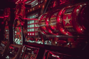 Close-up of colorful slot machine reels and display screens in a casino