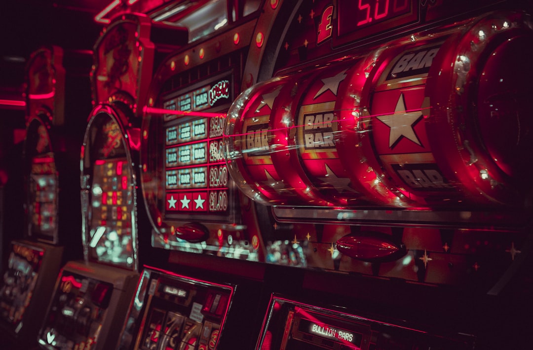 Close-up of colorful slot machine reels and display screens in a casino