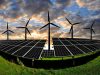 Solar panels and wind turbines at sunset in a field